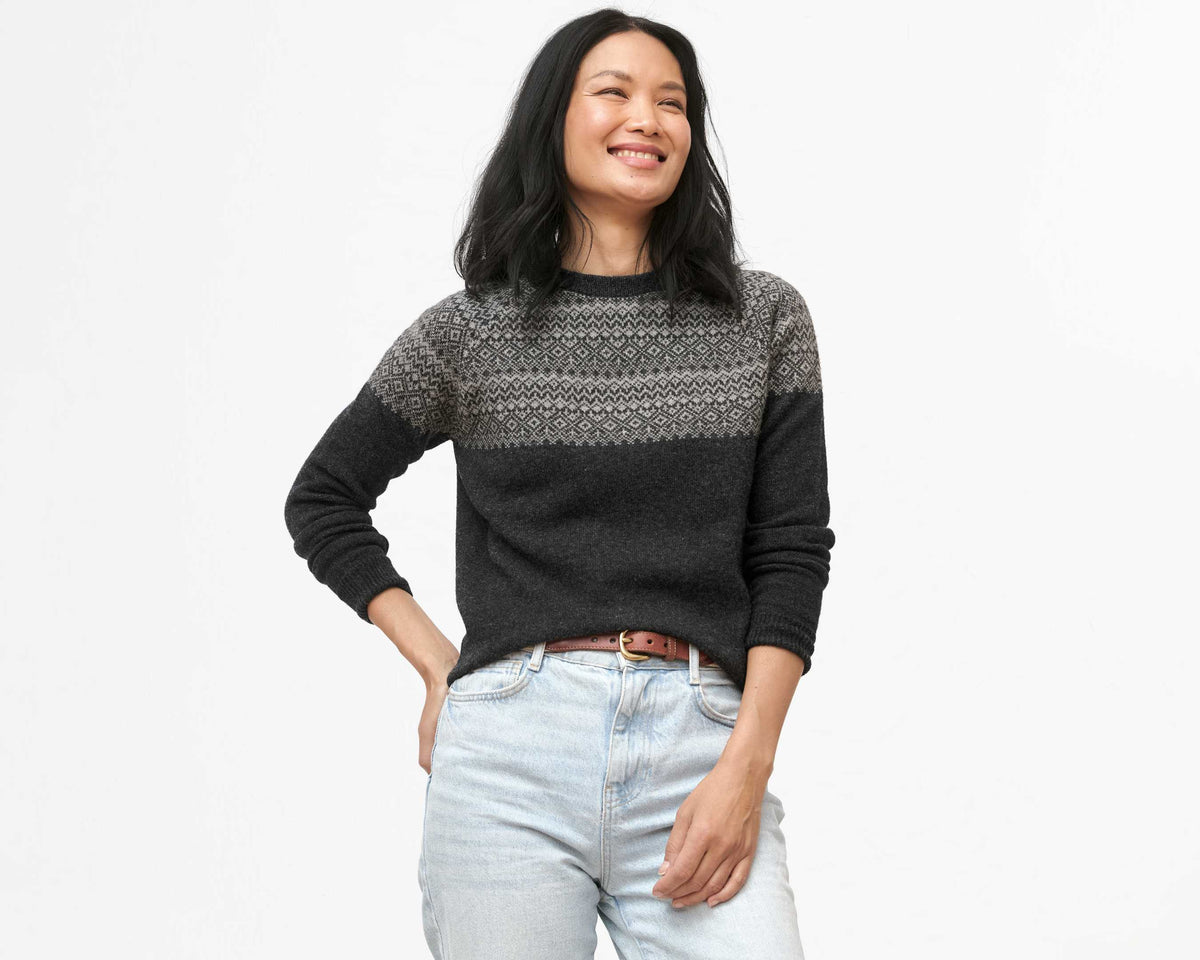 Woman wearing a fair isle sweater with jeans